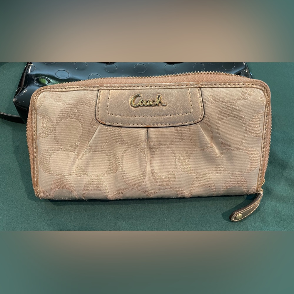 Authentic Coach Signature wallet zip around, gold with purple/gold interior